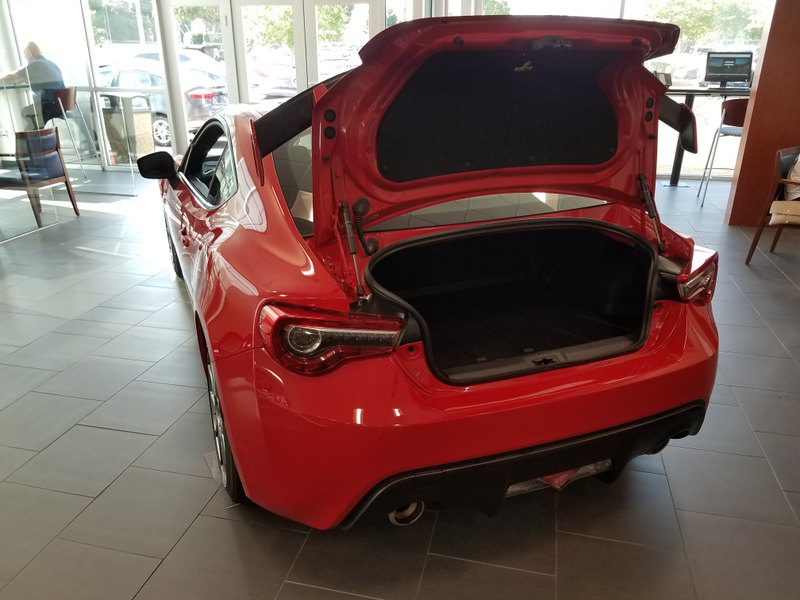 Smol opening, but can fit a spare set of wheels with the rear seat down